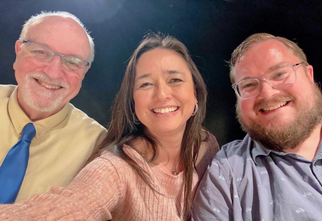 From left to right: Gary Witley, Jennifer Hermann, and Austin Schlichting smile for a group photo at the 2025 Youth Music Competition.