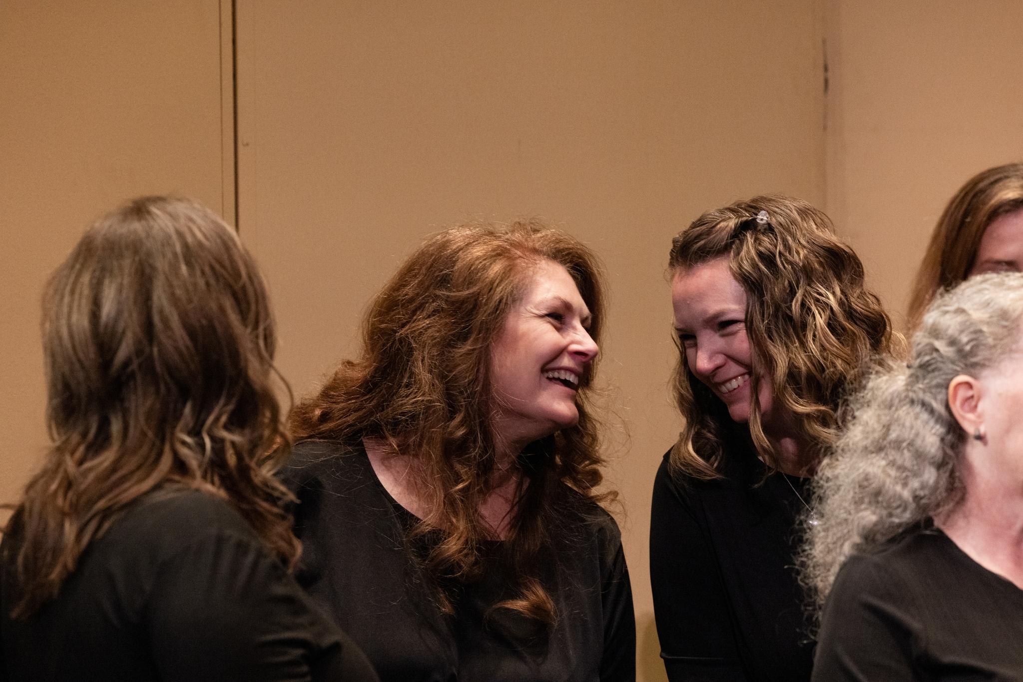 Members Julie Moffat (left) and Jessica Barnes (right) relax during a break in dress rehearsal.